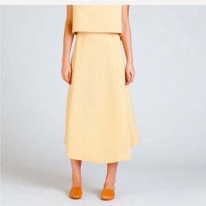 Kaarem Stream Deep Pleated Midi Skirt in Yellow.